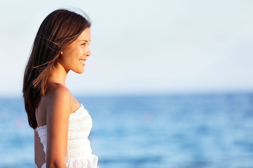 smiling woman on a beach